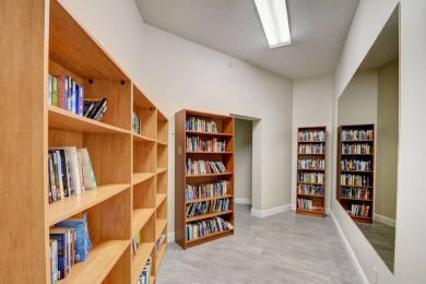Step inside this beautiful, spacious 4th floor apartment and you on Poinciana Golf Club in Florida - for sale on GolfHomes.com, golf home, golf lot
