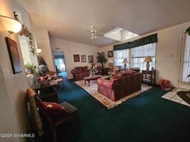 This charming 1995 Palm Harbor home, located in the vibrant 55+ on Pine Shadows Golf Course in Arizona - for sale on GolfHomes.com, golf home, golf lot