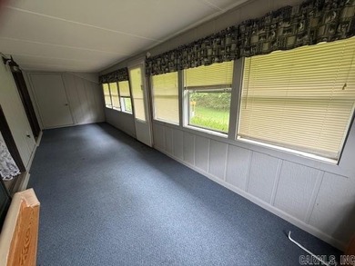 Carefree living in beautiful Cherokee Village conveniently on Cherokee Village North Course in Arkansas - for sale on GolfHomes.com, golf home, golf lot