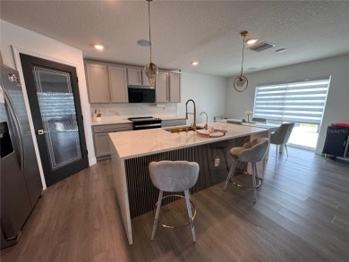 Welcome to this exceptional Zephyr Ridge residence, built in on The Links of Lake Bernadette in Florida - for sale on GolfHomes.com, golf home, golf lot