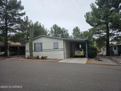 This charming 1995 Palm Harbor home, located in the vibrant 55+ on Pine Shadows Golf Course in Arizona - for sale on GolfHomes.com, golf home, golf lot