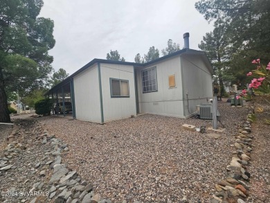 This charming 1995 Palm Harbor home, located in the vibrant 55+ on Pine Shadows Golf Course in Arizona - for sale on GolfHomes.com, golf home, golf lot