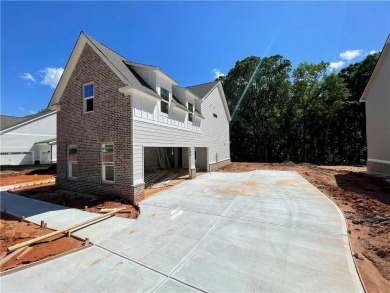 Stunning 2-story home with a 3rd car garage in a coveted on Traditions of Braselton Golf Club in Georgia - for sale on GolfHomes.com, golf home, golf lot