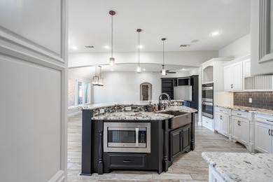 Stunning 4 bed, 3 bath home on the golf course with sweeping on Green Tree Country Club in Texas - for sale on GolfHomes.com, golf home, golf lot