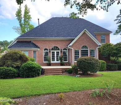 Discover this stunning all-brick home in the prestigious Cypress on Cypress Landing Golf Club in North Carolina - for sale on GolfHomes.com, golf home, golf lot