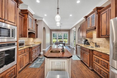 Experience the pinnacle of Oak Grove Island living with this on Oak Grove Island Golf and Country Club in Georgia - for sale on GolfHomes.com, golf home, golf lot