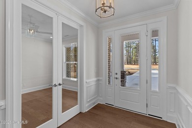 Settle into the ease of coastal living with this thoughtfully on River Landing Golf Course in North Carolina - for sale on GolfHomes.com, golf home, golf lot