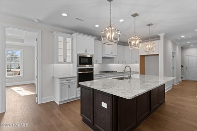 Settle into the ease of coastal living with this thoughtfully on River Landing Golf Course in North Carolina - for sale on GolfHomes.com, golf home, golf lot