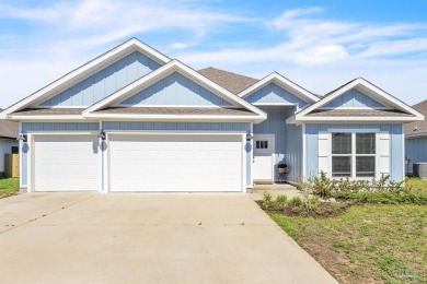 This beautifully designed 4-bedroom, 3-bathroom home with a on Tiger Point Golf and Country Club in Florida - for sale on GolfHomes.com, golf home, golf lot