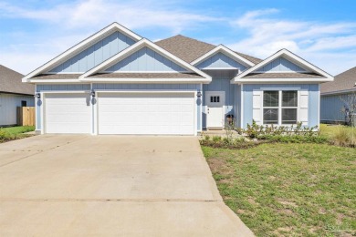 This beautifully designed 4-bedroom, 3-bathroom home with a on Tiger Point Golf and Country Club in Florida - for sale on GolfHomes.com, golf home, golf lot