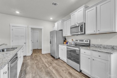 This beautifully designed 4-bedroom, 3-bathroom home with a on Tiger Point Golf and Country Club in Florida - for sale on GolfHomes.com, golf home, golf lot