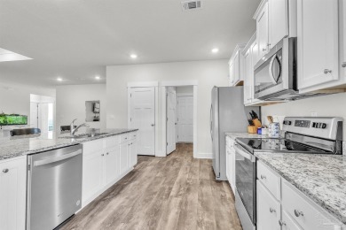 This beautifully designed 4-bedroom, 3-bathroom home with a on Tiger Point Golf and Country Club in Florida - for sale on GolfHomes.com, golf home, golf lot