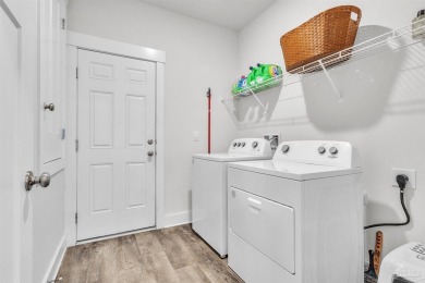 This beautifully designed 4-bedroom, 3-bathroom home with a on Tiger Point Golf and Country Club in Florida - for sale on GolfHomes.com, golf home, golf lot