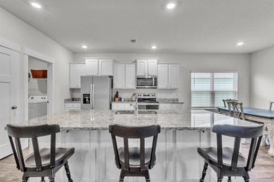 This beautifully designed 4-bedroom, 3-bathroom home with a on Tiger Point Golf and Country Club in Florida - for sale on GolfHomes.com, golf home, golf lot