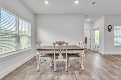 This beautifully designed 4-bedroom, 3-bathroom home with a on Tiger Point Golf and Country Club in Florida - for sale on GolfHomes.com, golf home, golf lot
