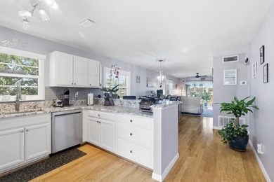 Desirable corner 'B' unit with split bedrooms and sweeping lake on The American Golf Club in Florida - for sale on GolfHomes.com, golf home, golf lot