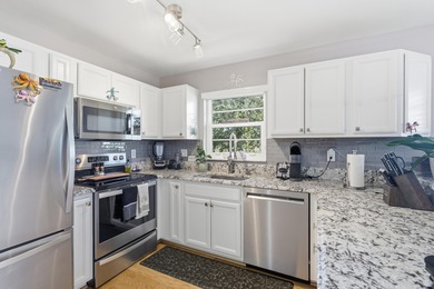 Desirable corner 'B' unit with split bedrooms and sweeping lake on The American Golf Club in Florida - for sale on GolfHomes.com, golf home, golf lot