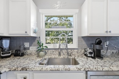 Desirable corner 'B' unit with split bedrooms and sweeping lake on The American Golf Club in Florida - for sale on GolfHomes.com, golf home, golf lot