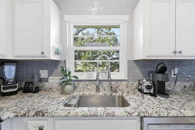 Desirable corner 'B' unit with split bedrooms and sweeping lake on The American Golf Club in Florida - for sale on GolfHomes.com, golf home, golf lot