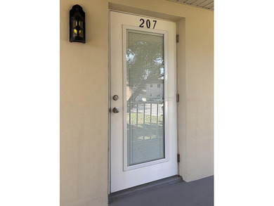 Desirable corner 'B' unit with split bedrooms and sweeping lake on The American Golf Club in Florida - for sale on GolfHomes.com, golf home, golf lot