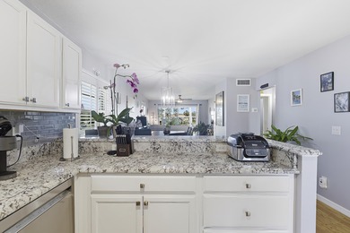 Desirable corner 'B' unit with split bedrooms and sweeping lake on The American Golf Club in Florida - for sale on GolfHomes.com, golf home, golf lot