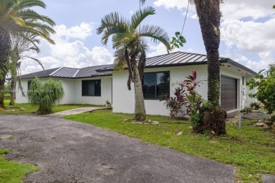 Welcome to this stunning 4-bedroom, 3-bathroom home at 17350 SW on Redland Golf and Country Club in Florida - for sale on GolfHomes.com, golf home, golf lot