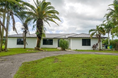 Welcome to this stunning 4-bedroom, 3-bathroom home at 17350 SW on Redland Golf and Country Club in Florida - for sale on GolfHomes.com, golf home, golf lot