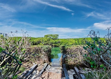 Located behind the gates of the prestigious Bay Isles, this on Longboat Key Golf Club Resort in Florida - for sale on GolfHomes.com, golf home, golf lot