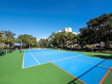 Located behind the gates of the prestigious Bay Isles, this on Longboat Key Golf Club Resort in Florida - for sale on GolfHomes.com, golf home, golf lot
