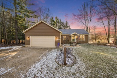 Prepare to fall in love with this captivating 5-bedroom on Canadian Lakes Country Club-The Royal Course in Michigan - for sale on GolfHomes.com, golf home, golf lot