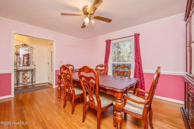 Welcome to a home where everyday living feels like a retreat on Deercroft Golf and Country Club in North Carolina - for sale on GolfHomes.com, golf home, golf lot