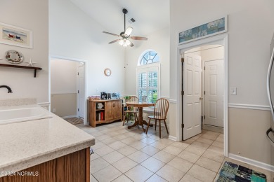 Discover this spacious 3-bedroom home with stunning pond views on Sandpiper Bay Golf and Country Club in North Carolina - for sale on GolfHomes.com, golf home, golf lot