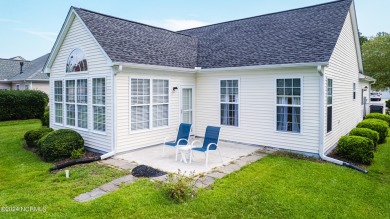 Discover this spacious 3-bedroom home with stunning pond views on Sandpiper Bay Golf and Country Club in North Carolina - for sale on GolfHomes.com, golf home, golf lot