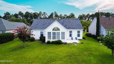 Discover this spacious 3-bedroom home with stunning pond views on Sandpiper Bay Golf and Country Club in North Carolina - for sale on GolfHomes.com, golf home, golf lot