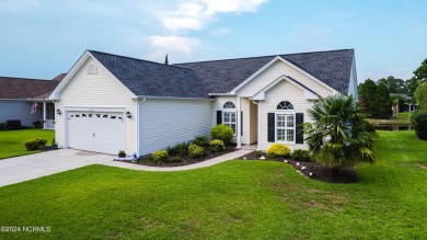 Discover this spacious 3-bedroom home with stunning pond views on Sandpiper Bay Golf and Country Club in North Carolina - for sale on GolfHomes.com, golf home, golf lot