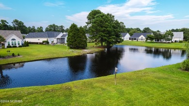 Discover this spacious 3-bedroom home with stunning pond views on Sandpiper Bay Golf and Country Club in North Carolina - for sale on GolfHomes.com, golf home, golf lot