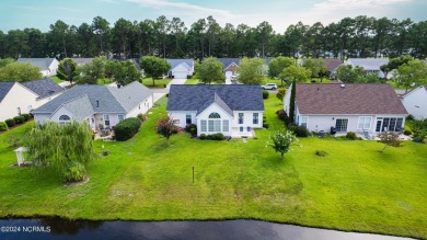 Discover this spacious 3-bedroom home with stunning pond views on Sandpiper Bay Golf and Country Club in North Carolina - for sale on GolfHomes.com, golf home, golf lot