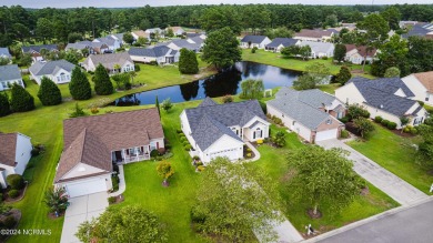 Discover this spacious 3-bedroom home with stunning pond views on Sandpiper Bay Golf and Country Club in North Carolina - for sale on GolfHomes.com, golf home, golf lot