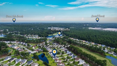 Discover this spacious 3-bedroom home with stunning pond views on Sandpiper Bay Golf and Country Club in North Carolina - for sale on GolfHomes.com, golf home, golf lot