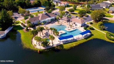 Discover this spacious 3-bedroom home with stunning pond views on Sandpiper Bay Golf and Country Club in North Carolina - for sale on GolfHomes.com, golf home, golf lot