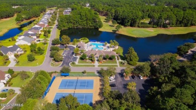 Discover this spacious 3-bedroom home with stunning pond views on Sandpiper Bay Golf and Country Club in North Carolina - for sale on GolfHomes.com, golf home, golf lot