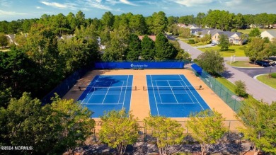 Discover this spacious 3-bedroom home with stunning pond views on Sandpiper Bay Golf and Country Club in North Carolina - for sale on GolfHomes.com, golf home, golf lot