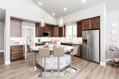 The Kingston has a large chef's kitchen with island, a spacious on Prairie Falls Golf Club in Idaho - for sale on GolfHomes.com, golf home, golf lot