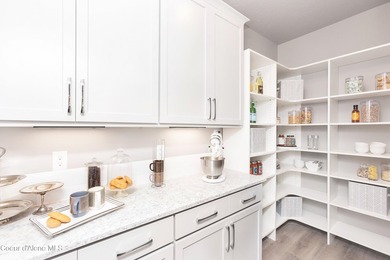 The Kingston has a large chef's kitchen with island, a spacious on Prairie Falls Golf Club in Idaho - for sale on GolfHomes.com, golf home, golf lot