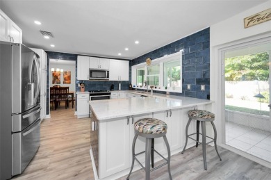 BEAUTIFULLY REMODELED and UPDATED home nestled in the highly on Highland Lakes Executive Golf Course in Florida - for sale on GolfHomes.com, golf home, golf lot