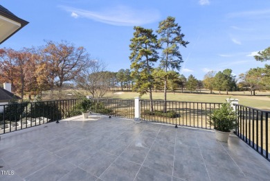 Backing to the 18th fairway of The Oaks course on a highly on North Ridge Country Club in North Carolina - for sale on GolfHomes.com, golf home, golf lot