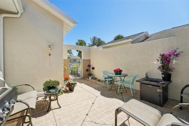 Welcome to this charming home nestled on a serene conservation on Scepter Golf Club in Florida - for sale on GolfHomes.com, golf home, golf lot