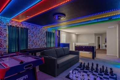 This professionally designed, fully furnished 7-bedroom, 5 on Highlands Reserve Golf Club in Florida - for sale on GolfHomes.com, golf home, golf lot