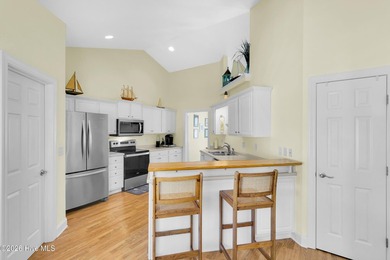 Light-filled, airy, and designed for easy coastal living, this on Harbour Point Golf Club in North Carolina - for sale on GolfHomes.com, golf home, golf lot