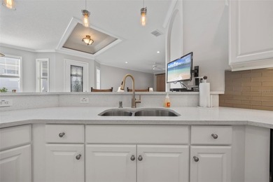 Imagine walking out your back door directly onto the golf course on The Groves Golf and Country Club in Florida - for sale on GolfHomes.com, golf home, golf lot